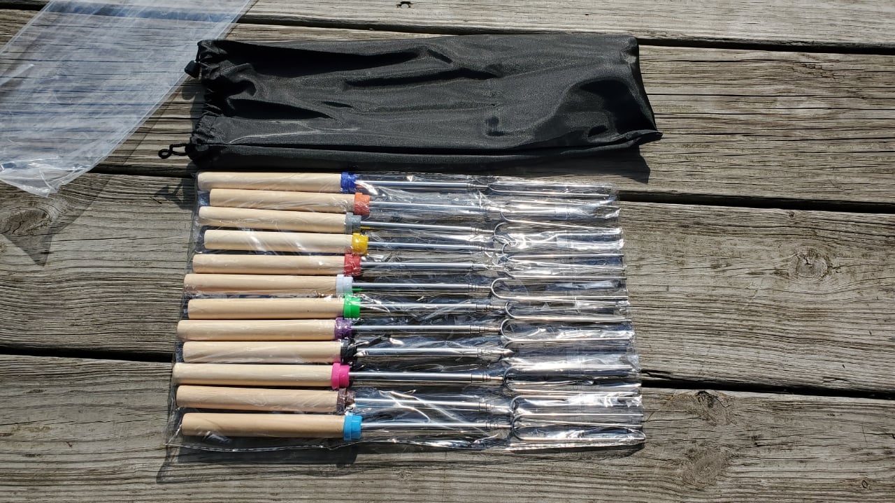 Set of 12, 32in telescoping, 2 prong roasting sticks with wooden handles and storage bag for easy portability. These 12 skewers also have different colored bands on the top of the handle for keeping track of whose/whose when camping or cooking with a group! They are light weight and easy to handle.